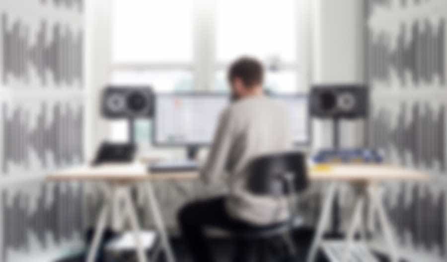 a man sitting and working with a machine