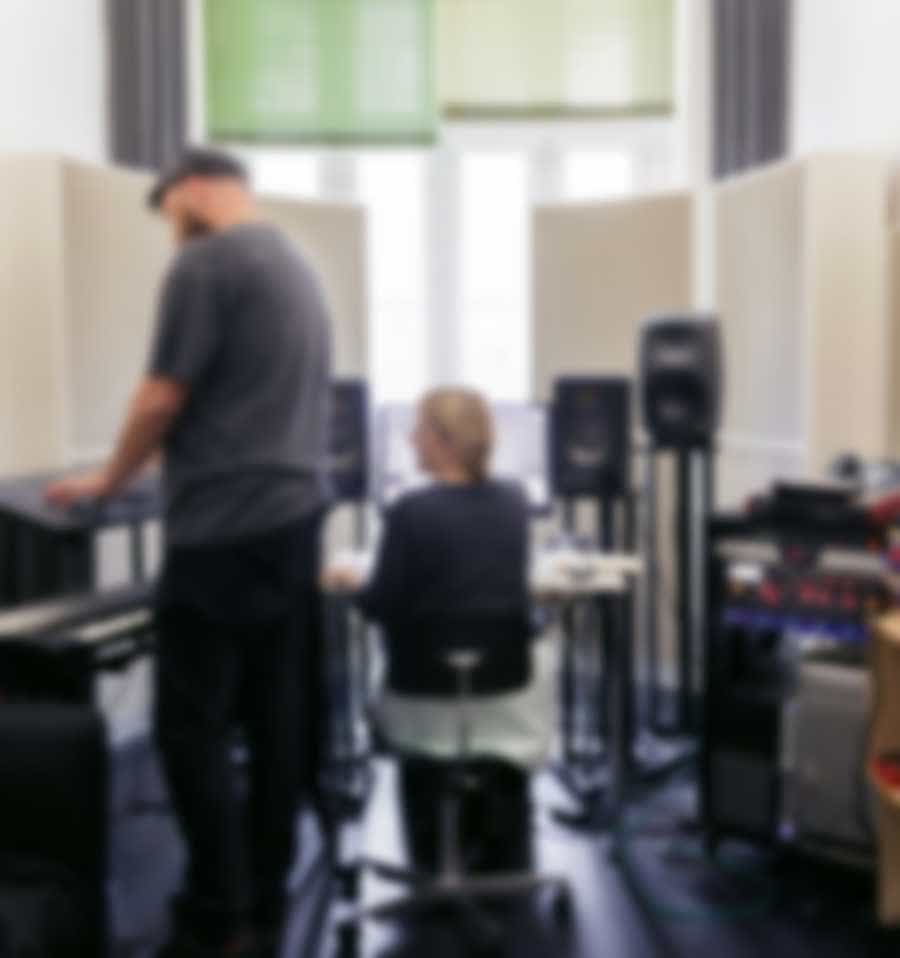 man standing and working by system